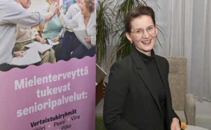 Nainen seisoo värikkään julkisteen edessä